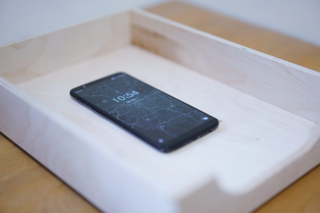 The OnePlus 5T smartphone laying on a table
